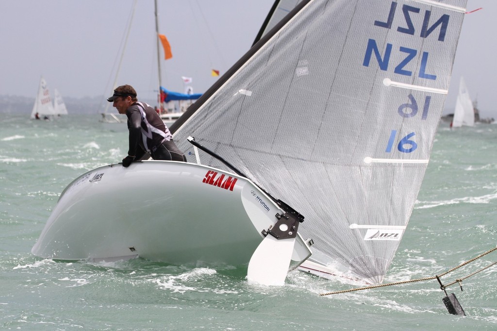 Double Olympian Andrew Murdoch snags a start line anchor rope - Day 4, Oceanbridge Sail Auckland 2013 © Richard Gladwell www.photosport.co.nz